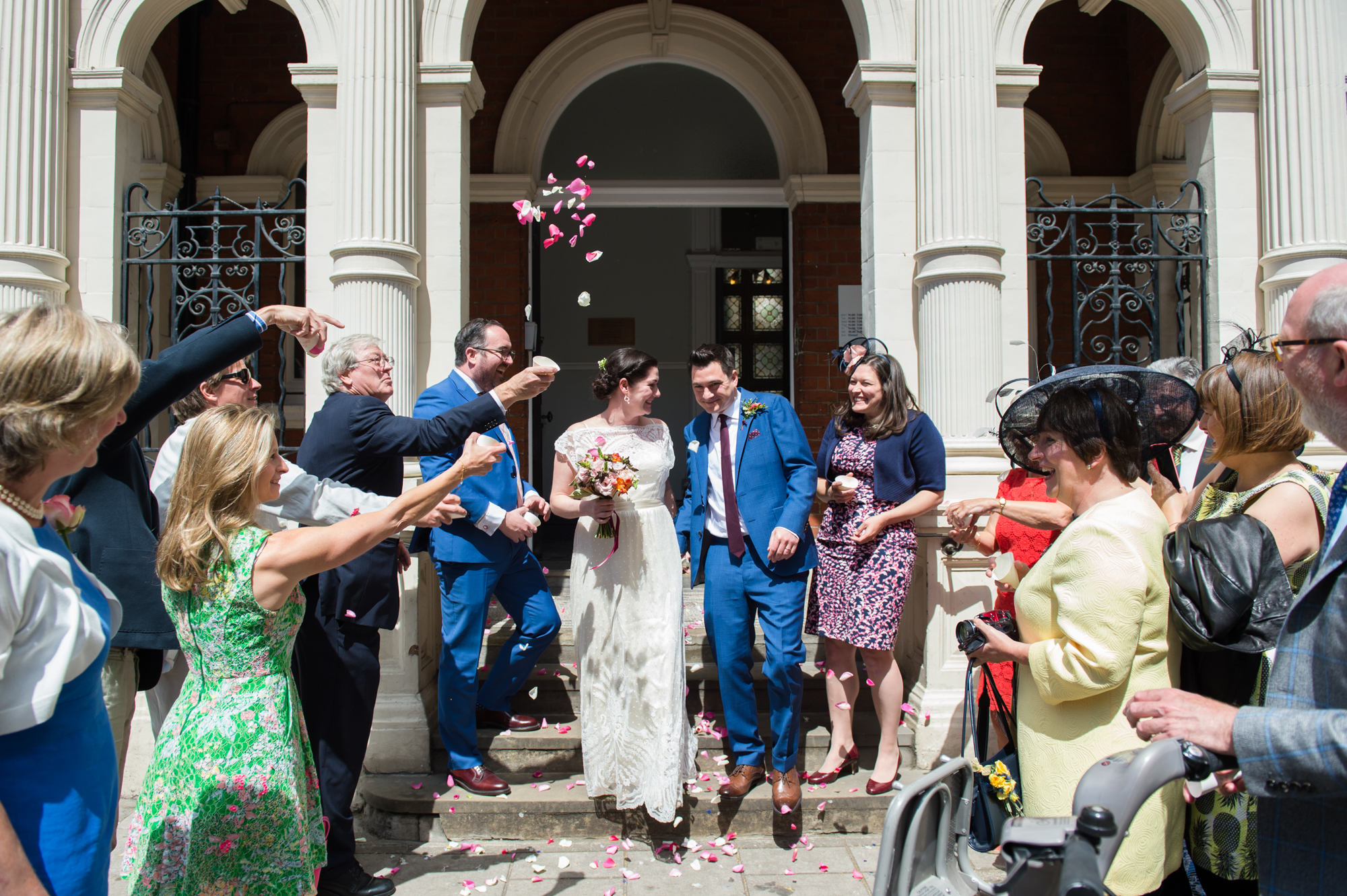 small wedding at Mayfair library couple with guests and confetti